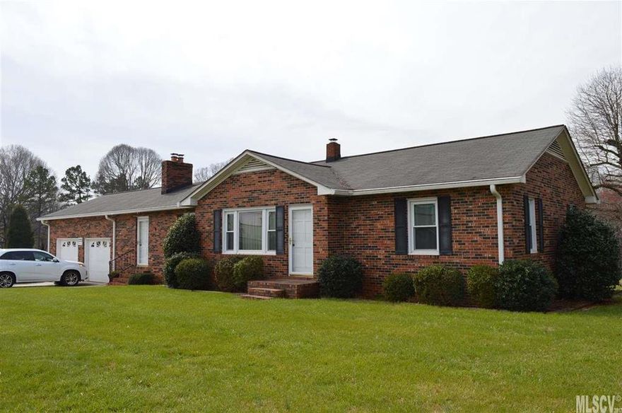 Wonderful brick ranch with basement on 4.84 acres!  Home has 3 bedrooms, 2 baths, kitchen, living room and den with fireplace.  The second bath is located in attached garage and is great for access when working outside or cleaning up before coming back into the house.  Attached oversized double garage is heated and cooled and has flue for potential addition of wood stove. This property also includes a double detached garage as well as additional storage buildings, a garden area and a mobile home. There are so many possibilities with this property.  Don't miss this rare find! City water available at the road per sellers. Replacement windows 2003. Seamless gutters with K Guard leaf free gutter system 2007. Storage building next to detached garage does not convey with property. Also metal cabinets in garage and basement are not attached and will not convey. Wooden cabinets and work benches will remain. Listing agent related to sellers.