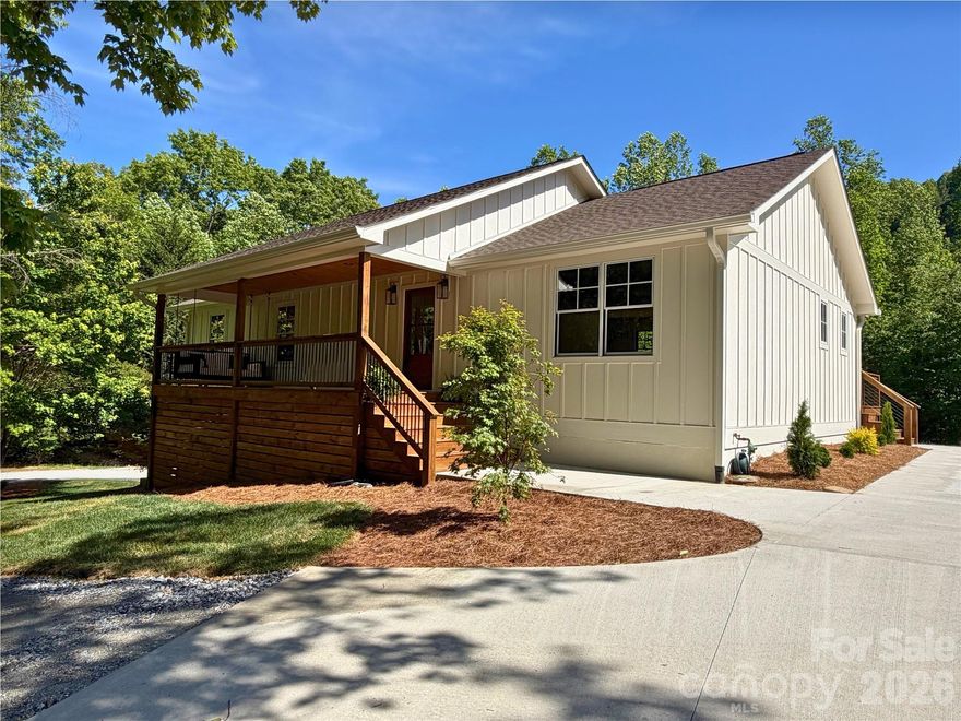 Experience an Exceptional Fully Renovated in 2026 Mountain Cottage Farmhouse. This turn-key home features a new roof, new hardi-board siding, Pella aluminum-clad windows, two new HVAC systems, new gas tankless water heater and new appliances and so much more.


Nestled on 2.66 acres in the desirable Saluda area, this beautifully renovated farmhouse style home offers the perfect blend of modern comfort and timeless cottage charm.  Thoughtfully redesigned with a bright, open layout and high-end finishes throughout, this home welcomes you the moment you arrive.


A brand-new driveway leads to a spacious new covered front porch–ideal for morning coffee or evening conversation.  Step inside through the handsome new wood farmhouse door into a warm and inviting interior. 


The completely new kitchen is a showstopper, featuring soft sage semi-custom cabinetry. A custom range hood, elegant granite countertops, and charming V-groove wood accent walls that create an authentic cottage atmosphere.  

Adjacent, the living room invites you to slow down and unwind with the custom brick gas fireplace and built-in cabinetry. Rich wood accents continue throughout, highlighted by new Pella wood windows and beautiful mantel. 


The primary bedroom suite continues the cottage theme with its own V-groove wood accent wall, while the spa-like primary bath offers a luxurious soaking tub and a large tiled walk-in shower.  Two additional bedrooms and guest bath with a cheerful blue vanity, tile floor completes the main level.  


The fully finished basement provides excellent versatility perfect as an efficiency mother-in-law suite, a short-term rental opportunity, or a fantastic family space with game room, TV area, and kitchenette. Offering a separate exterior entrance and private patio off the dining area make it ideal for guests or rental income.  The lower level also includes a full bathroom and is finished with durable, easy maintenance Mohawk LVP flooring. 


Outside, the brand-new board-and-batten siding and fresh exterior create classic farmhouse curb appeal, enhanced by the new covered porch and back deck. Enjoy the outdoor living with a lower creek, a fire pit area, and plenty of room for gardening or simply taking in the wooded views and wildlife.


Located in a wonderful mountain neighborhood, you’re just minutes from downtown Saluda, Hendersonville and short drive to Greenville, SC

A rare combination of quality renovation, thoughtful design and mountain setting awaits.

Important note: This home is served by a 3-bedroom septic system.

Some photos have been digitally enhanced.