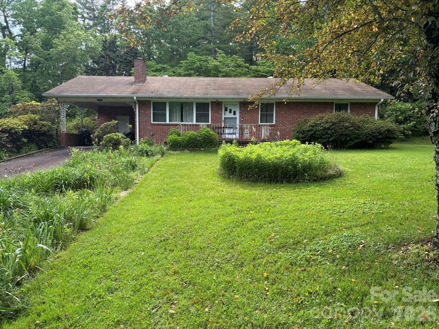 This brick ranch home is just waiting for you. 3 bedroom 1 bath home needs some TLC but seems to have great bones. Some original hardwood floors which you can bring back to their original beauty. Windows have been updated.  Sitting on 1.5 acres of land which is a flower lover's dream. Many verities of flowers but many varieties of day lilies. The original owner was a master of the day lily. Selling "AS IS". There is a camera on the property.