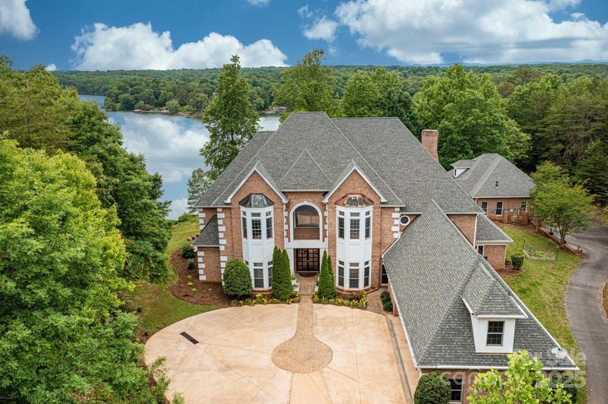 A long, private driveway leads to this magnificent waterfront estate situated on 10 acres on Lake Hickory.  Extraordinary custom 2.5 story offers breathtaking lake & sunset views! The luxurious interior features an exceptional floor plan w/impressive main level w/grand foyer, formal LR w/soaring ceiling, built-ins & gas fireplace, dining room, chef's kitchen w/top of the line appliances, island, butler's pantry & bar seating open to breakfast area & keeping room, a media room, guest bedroom & study.  Main level owner's wing w/sitting area & luxurious bathroom. Curved staircases lead to upper levels. 3 suites w/private baths, laundry room & bonus/billiard on 2nd. Gym on 3rd.  3 car garage in the main house. Guest cottage w/full kitchen, loft & 2 car garage.  Entertain year-round w/swimming pool, screened lanai w/built-in grill, lakeside cabana, lakeside patio w/firepit & covered boatslip w/mortorized lift, jetski dock, deep water & sandy beach area.  An absolutely amazing rare find!