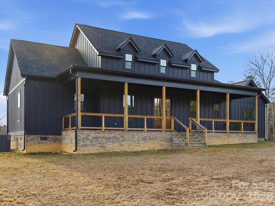 Stunning custom home nestled on 9.98 secluded acres! Offering the perfect blend of privacy, space, and thoughtful design. This beautiful residence features 4 bedrooms and 2.5 bathrooms, including a split bedroom floor plan and an open, airy layout ideal for both everyday living and entertaining. The great room showcases a cozy electric fireplace and flows seamlessly into the kitchen, complete with a large island, quartz countertops, walk in pantry, and abundant built in features. Enjoy a dedicated office, dining room, spacious laundry room, and a built in drop zone for added convenience. The primary suite boasts a vaulted ceiling, walk in closet, and spa like bath with double vanity and a large walk in shower featuring dual shower heads. Expansive covered front and back porches invite you to relax and take in the peaceful surroundings. Additional highlights include an attached carport, detached 3 car garage, and exceptional craftsmanship throughout. A rare opportunity to own a private retreat with modern comfort and custom touches. Welcome home to 785 Slick Rock Road!