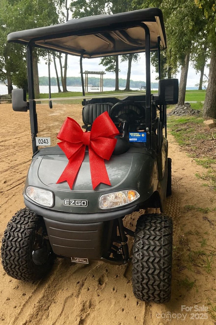 Nestled on flat, wooded lot, this charming home blends comfort & versatility.Unbelievable curb appeal in this mix of colonial & traditional 2-story home on cul de sac street.Kitchen boasts rich antique white cabinetry w/soft close drawers, granite counters, tumbled stone backsplash, SS appliances & island for additional workspace.Hardwoods throughout main level add warmth & character.Large primary suite upstairs features custom closet, ensuite bath w/tiled shower, relaxing garden tub, dual vanity. Secondary bedrooms include custom closets, maximizing storage & organization.Enjoy year-round outdoor living on large screened porch, overlooking a private backyard—perfect for gatherings or play.Breezeway connects the oversized 2-car garage which includes a huge walk-up storage space, offering endless possibilities for workshop or future expansion. Extra parking pad, Trex decking, louvered shutters & encapsulated crawl. Come home to a resort everyday in this amenity rich golf cart community!