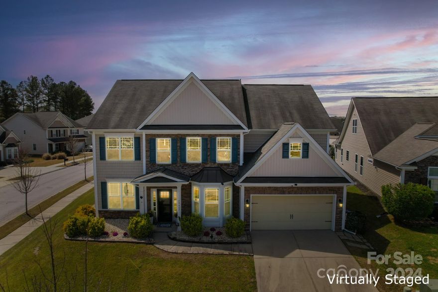 Welcome to your oasis in the highly sought after Walnut Creek in Indian Land! This gorgeous home is better than new. Large corner lot with fenced yard, offers privacy while you BBQ on your grill, relax in your beachy sand hammock, take a soak in the hot tub, or just relax in the screened in patio. The inside of the home is pristine. Wood laminate floors down, and matching LVP up. Vaulted entry has flex space and dining room. Open floor plan lets in so much light. The great room flows into the kitchen, making a great entertaining space. Custom kitchen island for casual dining/seating. Double ovens, gas cooktop, granite counters, and huge walk in panty make this a cooks dream! Main floor has a bedroom & full bathroom. Upstairs you'll find the primary bedroom w/ ensuite bath. Granite counters, soaking tub and separate shower. On the 2nd floor you'll also find 3 more spacious bedrooms, a full bathroom AND a bonus room! Fantastic neighborhood w/ 2 pools, walking trails, and so much more!