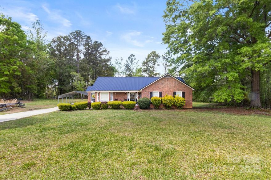 Welcome home! This lovely full brick house is sure to impress. Once inside the floorplan is open and airy. 3 bedrooms and 2 bathrooms complete the space. The living room is warm and inviting.The kitchen and dining room is open and designed for entertaining. The laundry room is just off on the kitchen and has a door for a quick exit. The house is very well maintained and shows like a model. With an acre of land its gives country living at its finest. There is a carport installed also. It has well and septic. New roof in 2022 and new HVAC in 2023. You need to see this one in person.