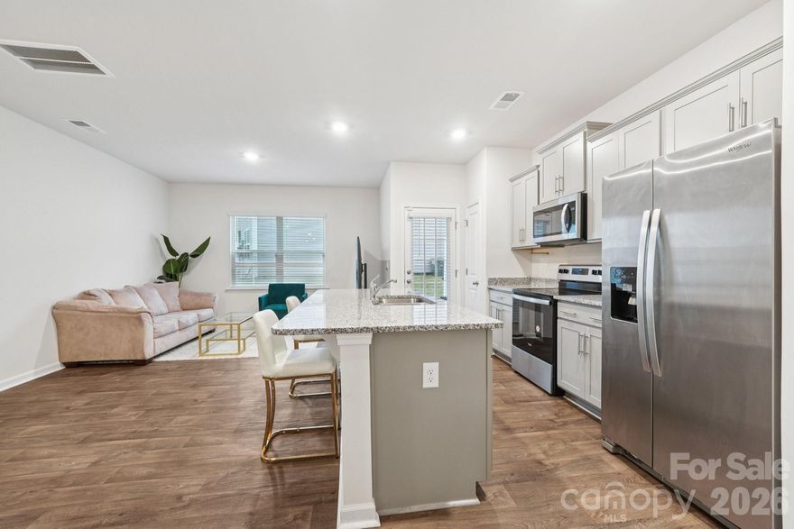 Welcome to Trinity Village, a less than 2-year-old townhome offering modern style and unbeatable convenience—minutes to Uptown, Northlake, Huntersville, and Mountain Island Lake.

The open-concept layout is perfect for everyday living and entertaining, featuring a spacious family room, dining area, and a chef-inspired kitchen with shaker cabinets, granite countertops, stainless steel appliances, and a large island for casual dining.

Upstairs, the primary suite impresses with a large walk-in closet and spa-like bath with dual vanities and an oversized shower. Two additional bedrooms offer space for guests, a home office, or workout room. This home includes smart-home features like a video doorbell, programmable thermostat, and keyless entry. Move right in and start living—everything feels brand new and can be yours for UNDER $300k!