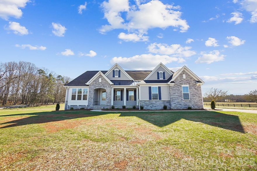 Meet the Charleston Plan, a beautifully designed home that blends spacious living with warm, thoughtful details. Even better, there are two brand new homes built side by side, giving buyers a rare opportunity to choose the perfect fit. Be sure to check out the brand new home just built next door at 7513 Lancaster Hwy, Waxhaw, NC 28173 as well.

Tucked into the charming community of Waxhaw, this home offers the best of both worlds, small town charm with quick access to everything Charlotte has to offer.

Step inside to a welcoming foyer with a formal dining room on one side and a flexible space on the other, perfect for a home office, playroom, or quiet retreat. The bright, open family room features a beautiful wall of windows and flows seamlessly into the gourmet kitchen, complete with an oversized island and sunny breakfast area that is ideal for entertaining or everyday living.

The owner’s suite is a true retreat, featuring a spa inspired bath with dual vanities, a walk in shower, and two walk in closets with plenty of room to unwind. A convenient drop zone at the garage entry keeps life organized, while the 996  sq ft of unfinished space offers endless potential for storage, a future bonus room, or hobby area.

Located just 7 miles from downtown Waxhaw, you will enjoy easy access to dining, shopping, and local events while savoring the peace and charm of country living. Best of all, this home is complete and move in ready.