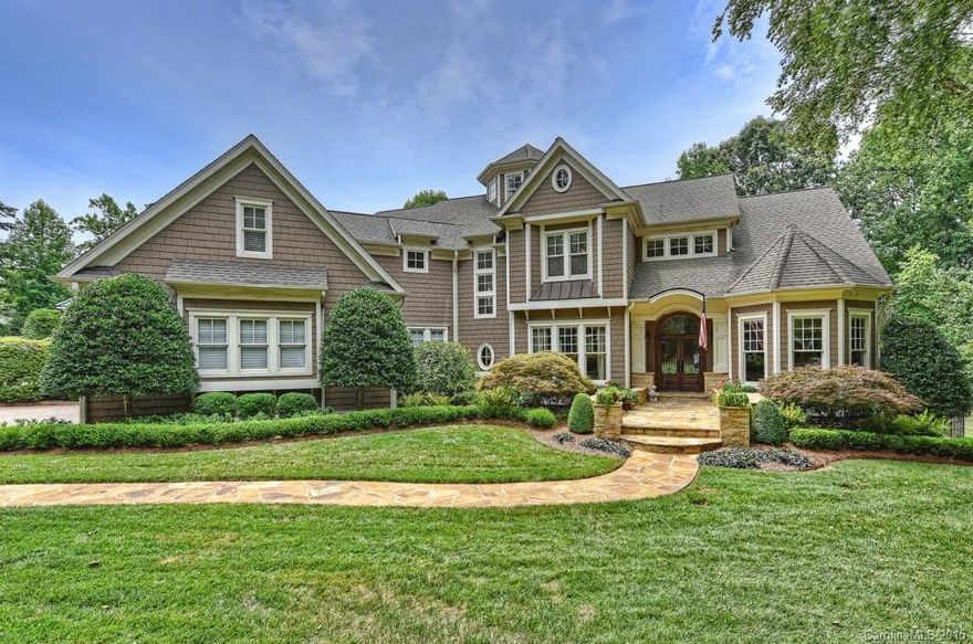 A premier home at the Point, this 4 BR 5.5 bath showplace in the sought-after Village section is dignified in every way with a soaring 2-story foyer, regal arched doorways, rich stones & marble, extensive woodwork, moldings, fireplaces, tray/beamed ceilings & open light-filled living/entertaining spaces that optimize flow & comfort. Rooms galore include a grand great room, dream chef’s kitchen, master BR retreat, gym, huge lower level. Outdoor oasis w/pool, hot tub, patios overlooking the lake.