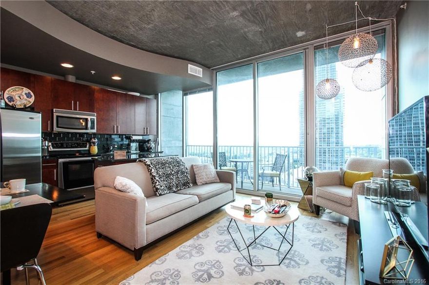 Unit features an open floor plan, hardwood floors in foyer, living and kitchen, upgraded fixtures, tile floor in the bathroom, cherry kitchen cabinets, granite counter tops and stainless steel appliances. Large private terrace. Building amenities include 24 hour concierge, grand lobby with water wall, elevated swimming pool, state of the art fitness center, club room, billiards, movie theater room and more!