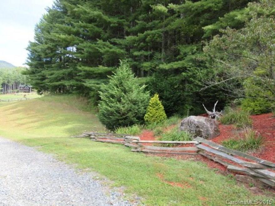 DESIRABLE BEECH CREEK COMMUNITY! This is really a special lot with a view of the park, pond, picnic area and hiking trails. Also awesome views of surrounding mountains! Lovely flowers garden in the lower corner of the lot. On the side of the lot a driveway has been roughed in to a good building site. Beech Creek even has accommodations for horses! This is a great lot at a bargain price! Be sure to take a look at this one!