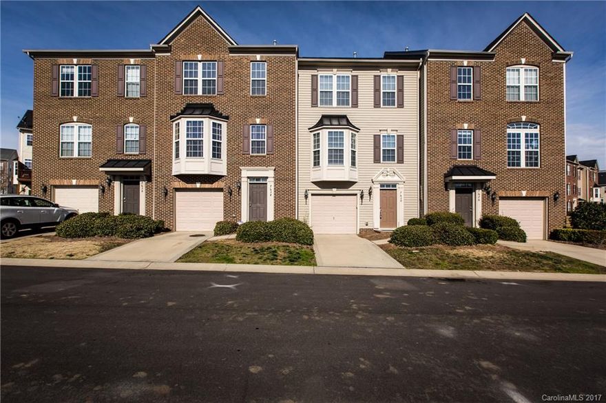 Beautiful townhome in the wonderful community of Ayrsley. 1st floor has attached 1-car garage, bonus room and lots of closets. Main level has lots of natural light and an open floor plan, perfect for entertaining. Updated kitchen with granite, dark wood cabinets, and tile backsplash. Dining room has tray ceiling, bay window and a wet bar. 3rd floor has master bed/bath and 2 additional bedrooms & bath. Neighborhood offers a community pool and close distance to other entertainment. A must see!