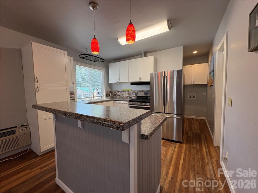 Ideal Lake getaway or full time residence. A "gutted" camper w/ addition checks all the boxes. The camper side provides a large BRM behind a sliding barn door w/ room for a King bed & sitting area w/ direct access to the camper BRM w/ towel warmer.  The secondary BRM is the original camper BRM w/ built in storage. (Camper bed has been removed). The addition offers a "Full" Kitchen including a propane gas 5 burner range, full size French door refrigerator w/ ice maker, Bosch DW, double sink and a pantry cabinet w/ pull out shelves. An island w/ breakfast bar overflows into the dining / living room. Two access points from this area to the outdoor deck. A second full bath offers a full size tub/shower, towel warmer & vanity. A washer hookup is in the hall w/ room to add a stackable if desired. (Dryer hook up is in the Shed). Extend living outdoors on a partially covered deck w/ room to dine, grill, relax & enjoy a firepit on those chilly evenings. Come and enjoy all that BSR has to offer! CASH ONLY SALE