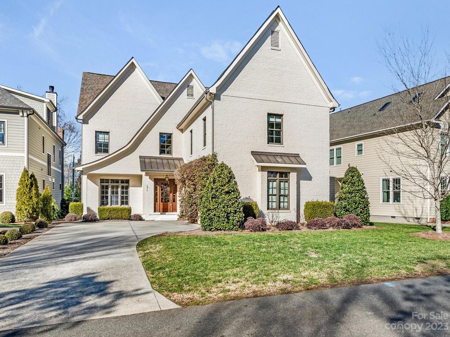 171 N Canterbury Road is located in the heart of Cotswold, custom built by Grande Builders. Enter into a bright foyer with the formal dining room on your left. Fabulous chef's kitchen includes Thermador appliances, oversized marble island and breakfast area which opens to a generous family room. Large sliding glass doors open to a screened porch with vaulted ceilings and gas fireplace that is great for entertaining. Two grilling stations, including a grill and green egg. Guest suite or private office on the main level.  Upstairs includes a large Primary bedroom with vaulted ceiling, ensuite bath with double vanity, soaking tub, shower and large walk-in closet. Three additional bedrooms, office, laundry and entertainment/bonus room. Backyard is impeccably landscaped. Private walkway to community garden. Attached two car garage. Don't miss this move-in ready, immaculate home located minutes from uptown, South Park, shops and restaurants.