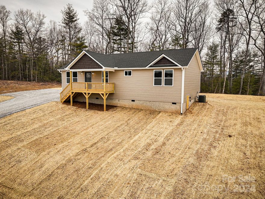 Bellflower Meadows is a 16 lot subdivision in the heart of Apple Country. Minutes to your favorite fall hay ride and apple picking. Less than 10 minutes to grocery stores and restaurants and only 15 minutes from downtown Hendersonville. Big flat yard! Open floor plan bathed with warm natural light is perfect for entertaining. Roomy primary bedroom boasts a large walk-in closet and primary bath with dual vanity and custom tile shower. Luxury vinyl plank flooring, fabulous kitchen with stainless steel appliances, granite counters, spacious all-plywood soft close cabinets, under cabinet lighting, and the perfect kitchen island. Neutral colors make decorating a breeze. A spectacular place to enjoy that clean mountain air. Well-priced, move-in ready and waiting hold all of your fond memories or become your next charming retreat or sought after investment property. Finished interior pictures are shown as an example. Tax value based on previous vacant land does not represent improvements.