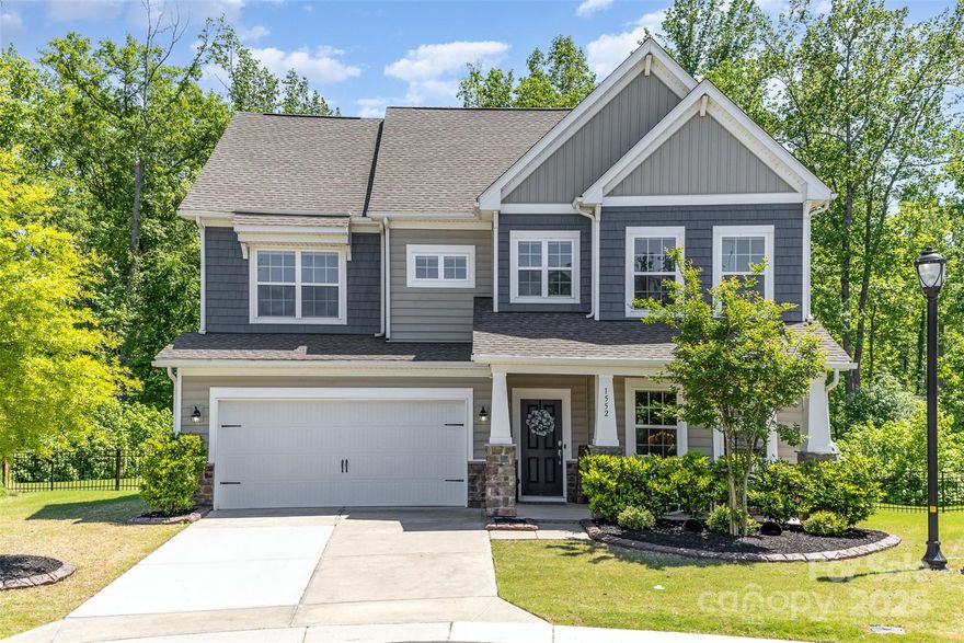 Welcome to your dream home in highly sought-after Waterside at the Catawba! This spacious 5-bedroom, 4-bath beauty sits on a private cul-de-sac lot with a flat, fenced backyard backing to serene trees — perfect for outdoor living and play. Step inside to a light-filled, open floorplan designed for modern living, with abundant natural light pouring into every room. Enjoy a luxurious primary suite, generous secondary bedrooms, with a guest bedroom and a full bath on the main level as well as a home office. Waterside offers resort-style amenities including a clubhouse, pool, fitness center, tennis courts and walking trails. Zoned for award-winning Fort Mill schools and minutes to shopping, dining, and I-77! Don’t miss this move-in ready gem with the backyard privacy you’ve been searching for! 
Please verify school assignment and possible school freezes.