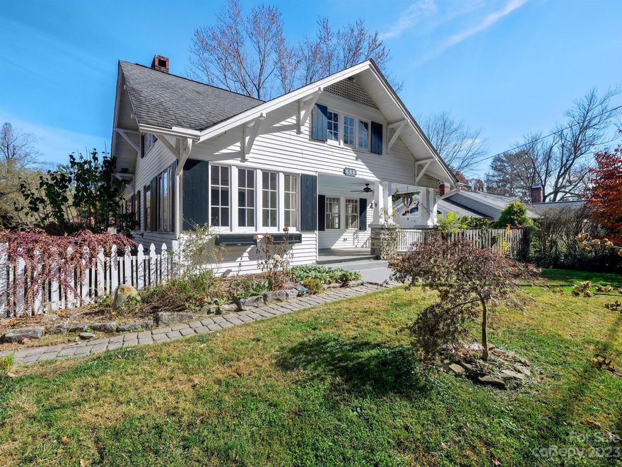 Gorgeous 1925 historic home in downtown Hendersonville. Filled with charm and character, this home is a perfect blend of farmhouse style and modern elegance. This rare downtown Hendersonville home boasts 10ft ceilings, original hardwood flooring, period windows, updated kitchen with handmade black walnut countertops, spacious formal dining area, main level renovated bathroom, tons of storage, home generator and covered front porch(See attached feature sheet form for more updates). You will love the open floor plan and natural light that fills this home! Downstairs you will find additional bonus space and bedrooms which would make for a great mother-in-law suite with walkout, heated sunroom overlooking the quaint garden entertainment area. Property also makes for a great Airbnb property in close proximity to all the fine dining and entertainment Hendersonville and Flat Rock have to offer. and less than a half mile from Ecusta Trail. Don't miss the opportunity to own this amazing home!!