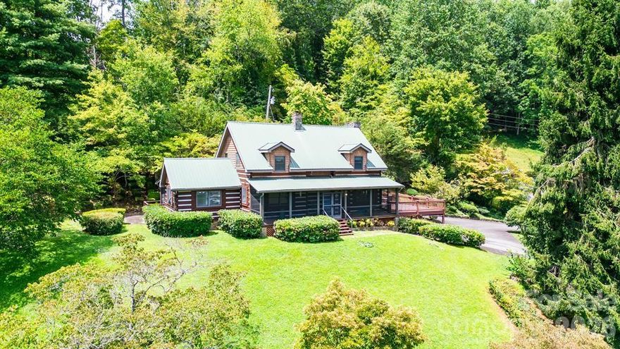 Step into timeless mountain living with this 3 bedroom, 3 bath Chink log cabin, offering exceptional craftsmanship and a warm, inviting atmosphere. The spacious main living area showcases a gorgeous floor to ceiling stone fireplace, perfect for cozy evenings, while the dining room impresses with cathedral ceilings accented by rustic beams. The main floor bedroom offers exceptional space and a view and the large kitchen blends function and charm. Upstairs, you’ll find two generously sized bedrooms, including a primary suite with its own stone fireplace. The finished lower level offers a second living area, a full bath, and flex space that could easily serve as a home-based business location for an accountant, therapist, or creative studio. Enjoy gorgeous mountain views from the expansive deck, or unwind on two screened-in porches. Located just off Hwy 74, this home offers quick access to Sylva, Waynesville, and all the beauty of Western North Carolina. Whether you’re seeking a full-time residence, vacation getaway, or a unique live/work opportunity, this property delivers both charm and convenience. This home is being sold mostly furnished.