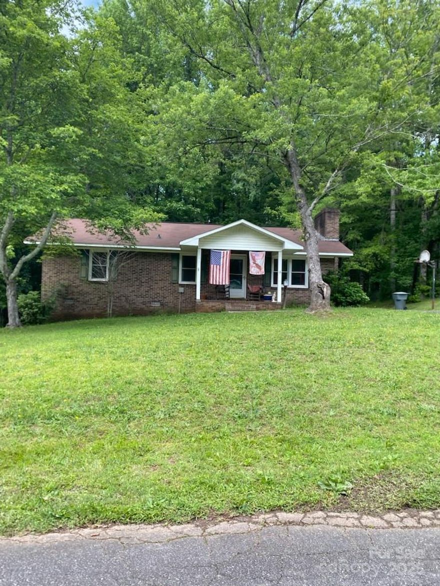 This  "as-is" brick ranch is a 3 bedroom, 2 bath home ready for a new owner!  Tucked back amongst the trees within walking distance of downtown York, this home is full of possibilities. On the back of the home, there is a large deck and a storage shed and room for gracious outdoor living.