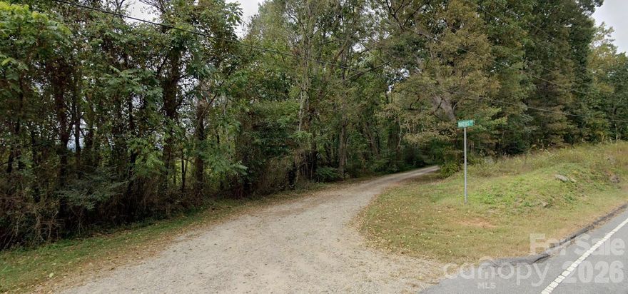 Discover 6.14 private wooded acres at the base of Redmond Mountain on the edge of the Brushy Mountains in Union Grove. This corner parcel offers a rare combination of natural beauty and accessibility, with frontage on both NC Hwy 115 and Mathis Road.

Brushy Creek borders a portion of the property, creating a peaceful setting ideal for a private estate, retreat, or custom-built residence. The land features mature trees, rolling topography, and multiple potential build sites. Zoned RA with no known restrictions, offering flexibility for residential use.

Conveniently located approximately 8 miles from I-77, providing easy access to Statesville, Elkin, local wineries, outdoor recreation, and everyday amenities—while maintaining a secluded, mountain-edge feel.

If you’ve been searching for acreage with character, water frontage, and privacy—this property delivers.