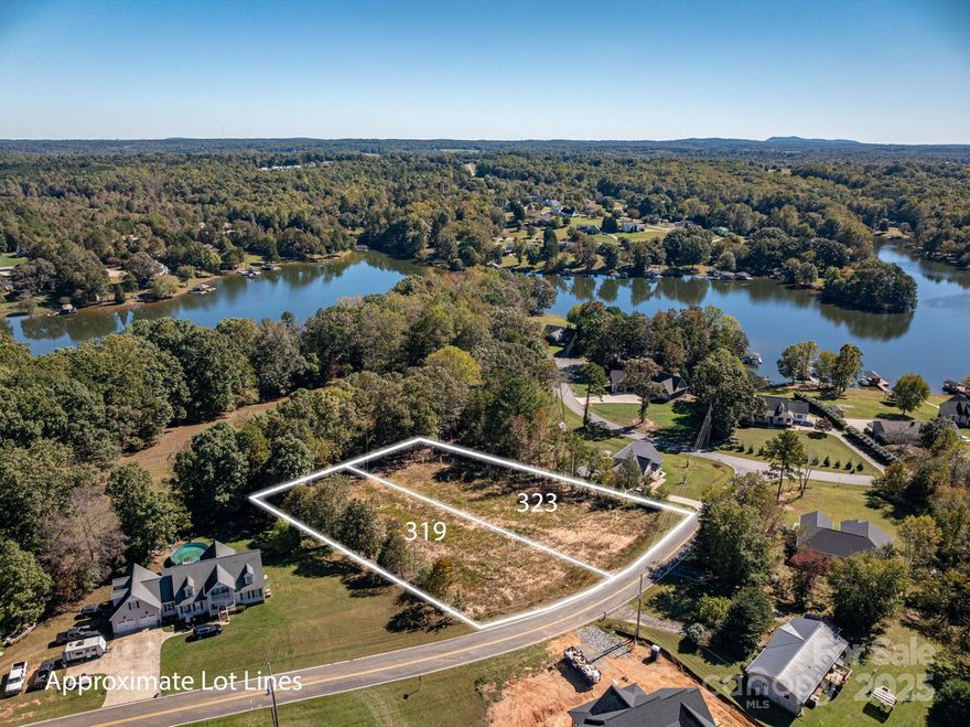 Attention builders and those looking to build a dream home on a beautiful cleared lot near Moss Lake in the desirable Harbor View community! This property has already been cleared and has received a Certificate of Approval for a 4-bedroom home, making it truly build-ready. Enjoy seasonal lake views, peaceful surroundings, and the flexibility of purchasing the adjoining lot for extra space or added privacy (MLS #4312952). Conveniently located near Cherryville, Shelby, Kings Mountain and Gastonia, this property combines the charm of lake living with easy access to nearby amenities. Don’t miss your chance to create your ideal home near one of the area’s most scenic lakes. The lot address is also listed as a proposed new construction and this vacant lot price is included in the list price of that proposed build (MLS # 4313731). Use address 323 Harbor View Drive to locate this lot.