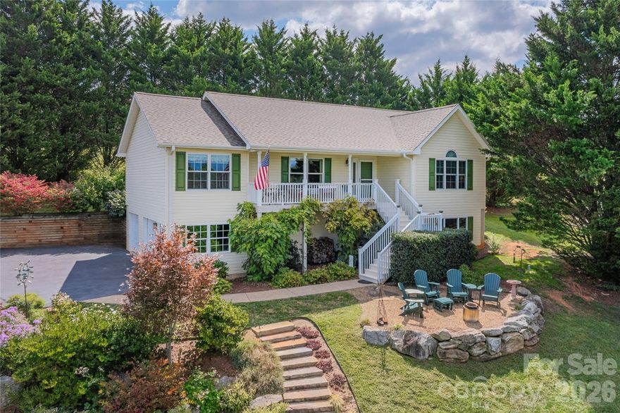 This updated residence has it all! The generously sized lot and home's positioning offer privacy from neighboring properties while providing unobstructed direct western mountain views. Perfect for those seeking sunset vistas. Flower enthusiasts will appreciate the meticulously kept garden filled with a variety of local species. Entertain on the terrace, covered front porch or the private rear deck.
Enjoy the unique combination of an open floor plan, vaulted ceilings, and a split bedroom plan. Adjoining the spacious primary bedroom is a fully renovated en suite bathroom. The remodeled and expansive kitchen is sure to please, with Maytag appliances, a dedicated pantry, and chocolate glaze detail on the cabinetry. The basement level can serve as a large guest quarters, viable mother-in-law suite, home office, study or recreation room. Please see the full list of features and upgrades available in the attachments. Propane fuel services gas logs, otherwise all electric. This property is located 3 miles to North Buncombe County schools, 10 minutes to Weaverville Boulevard for major shopping and services, 20 minutes to downtown Asheville, and just 30 minutes to AVL airport. Untouched from storm Helene. In late 2025 French Broad Electric cleared trees along the power lines and the photos reflect the new landscape which included rolled lawn turf. As of 4/1/26 the sellers have invested $4k in having 12 new trees on this northeast property line which act as a growing natural fence, perfect for those seeking natural means of fencing. Schedule your preview today!