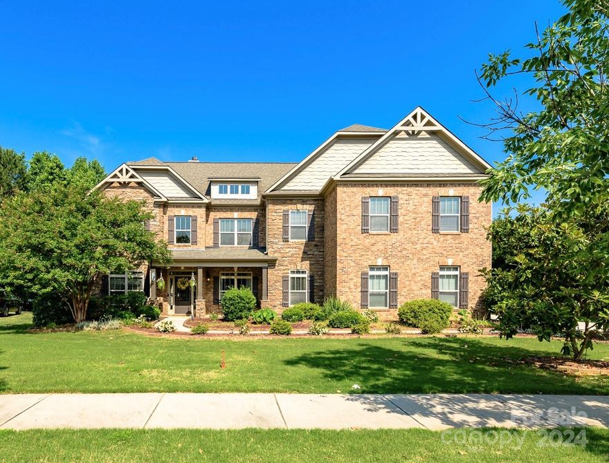 Discover luxury in this beautifully renovated, smartly designed, wheelchair-accessible home. The private backyard oasis and meticulous construction are distinguishing features of this property. Highlights include a rare wheelchair-friendly main level with a bedroom, roll-in wet room and separate guest half bath. The chef's kitchen boasts a 6 burner GE Cafe gas cooktop with pot filler, quartzite counters, new cabinetry, a keeping room and breakfast area. The versatile floor plan supports multigenerational living and offers ample home office / flex space. Retreat to the expansive primary suite with cozy sitting room and fireplace. Enjoy the serene backyard, adorned with lush landscaping, a pergola-covered patio, pavered fire pit / grilling area and a tranquil lower level gathering space.  Additional features include high ceilings, extensive moulding, updated flooring, fresh paint and a 3 car garage. The main level flooring is designed for wheelchair use. Easy access to Lake Norman!