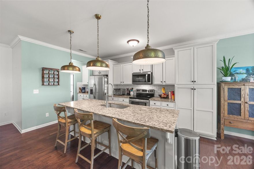 Bright, open, and move-in ready, this beautiful one-story home blends modern finishes with timeless charm. Sunlight floods the open-concept living area through large windows, accentuating the gleaming hardwood floors to create an inviting space for everyday living and entertaining.

The well-appointed kitchen offers ample counter space, a convenient breakfast bar, and plenty of room for meal prep. The generously sized primary suite serves as a private retreat, featuring a luxurious en suite with a walk-in shower, dual vanities, and a large walk-in closet. Outside, you can enjoy a fully fenced backyard perfect for relaxing or gardening. New water heater and refrigerator. 

The home is conveniently located near shopping, dining, and the Catawba River Trailhead, providing easy access to the Catawba River.