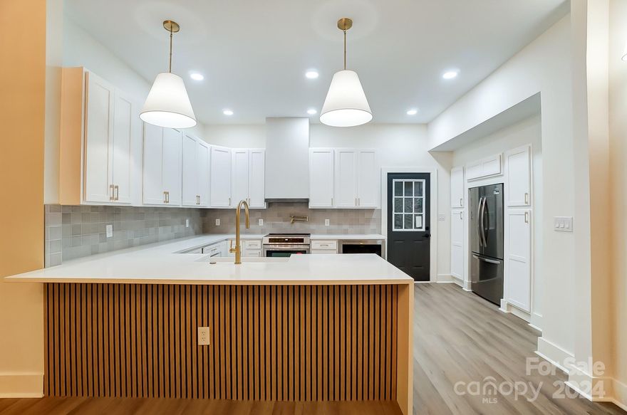 Look no further: Desirable Spring Valley with Primary Bedroom on Main! Minutes from Little Sugar Creek Greenway & SouthPark with no HOA! Renovated from top to bottom. Gorgeous 4 bedroom on private cul-de-sac - must love deer!! 16' ceiling w/ elevated windows brings natural light into open living area. Professionally designed so you have to do nothing! Primary bedroom has over-sized walk-in shower, barn door, walk-in closet, & deck access! Kitchen includes soft-close white cabinetry w/ brushed gold designer hardware, farmhouse sink, pot filler, garbage disposal w/ air switch, custom hood, new stainless steel appliances, & quartz waterfall island. Other upgrades include wood plank luxury vinyl floors throughout, soft-close cabinets in bathrooms, custom fireplace, hand picked fixtures & faucets, and fresh interior paint. Brand new roof, updated electrical & plumbing. Huge laundry room with cabinetry. Preferred lender offering rate incentives & appraisal credit for approved buyers!