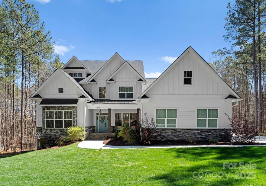 Experience unparalleled elegance in this 5-bedroom, 4.5-bathroom home, offering 6,477 sq. ft. of refined living space on a sprawling 1.62-acre lot. Built in 2021, this home boasts a fiber cement and stone exterior with an in-ground irrigation system for effortless lawn maintenance. Designed for both comfort and entertainment, the fully fenced backyard features a saltwater in-ground pool, an outdoor fireplace, and prewired speaker locations with a smart panel. A 12’x8’ pocketed sliding door opens to a screened-in back porch, seamlessly blending indoor and outdoor living. Inside, enjoy spacious living areas, a walkout finished basement, and custom California Closet systems throughout. The second-floor walk-in attic provides ample storage, while the three-car garage ensures plenty of parking and workspace. This exceptional property is a rare find! — Community boat ramp and day slips available — boat storage available for an additional fee.