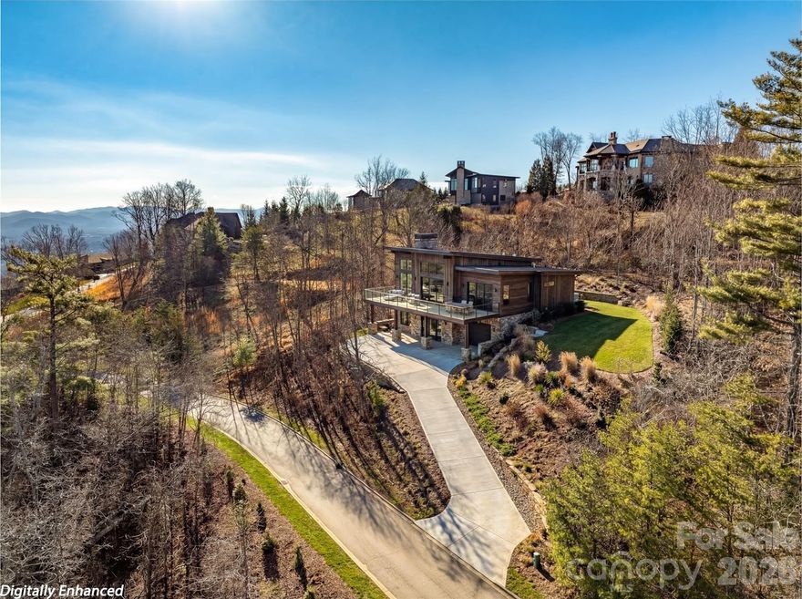 An exceptional opportunity to create your mountain retreat in Reynolds Mountain, one of Asheville’s premier luxury communities. This home is to be built by Living Stone Design + Build, one of Western North Carolina’s most respected and award-winning luxury green builders. Named 2023 Custom Home Builder of the Year by the National Association of Home Builders, Living Stone is known for exceptional craftsmanship, bespoke design, and impeccable standards. Situated on a gently sloping lot of over one acre, this stunning residence will feature the “Cedar” floor plan by renowned architect Moss Creek—a thoughtful blend of timeless mountain-modern architecture, refined finishes, and high-performance construction. Designed with both beauty and livability in mind, the home will offer 4 bedrooms, 3.5 baths, and spacious open living areas that seamlessly connect indoor and outdoor spaces. Large windows will frame the surrounding mountain views and flood the home with natural light, while soaring ceilings, high-end finishes, and a warm fireplace create a welcoming retreat. Enjoy sunrise over the peaks with coffee from the covered outdoor living area, or unwind with a book while taking in the peaceful mountain setting. Built to Green Built and Energy Star standards, the home reflects Living Stone’s commitment to healthier, more efficient living. Reynolds Mountain offers a rare balance of tranquility and convenience. Residents enjoy paved roads, private hiking trails, and a community pavilion with fireplace and grill, along with infrastructure including city water, city sewer, natural gas, underground utilities, and high-speed internet. Ideally located in North Asheville, just minutes from downtown Asheville, the Country Club of Asheville, dining, shopping and everything the area has to offer. Don’t miss your rare chance to build a custom luxury home with one of the region’s most sought-after builders in one of Asheville’s most desirable mountain communities.  Call for more information!