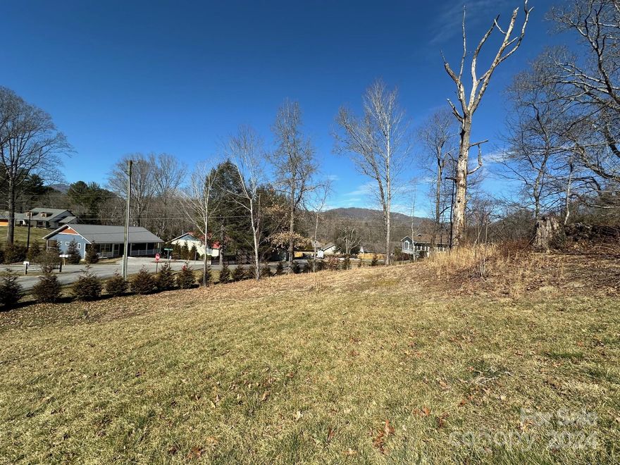 Bring your building plans for this corner lot in the quiet Holston Village area of beautiful Lake Junaluska. The gentle sloping lot enjoys mountain views and convenient location near Lake Junaluska amenities. Drive your cart to the golf course. Minutes to Waynesville, Maggie Valley, the Blue Ridge Parkway and downtown Asheville is only 25 minutes away. City water and city sewer available, as well as Spectrum high speed internet. Subject to Lake Junaluska R&R. Great spot for a primary residence or vacation home (short term rentals allowed!)