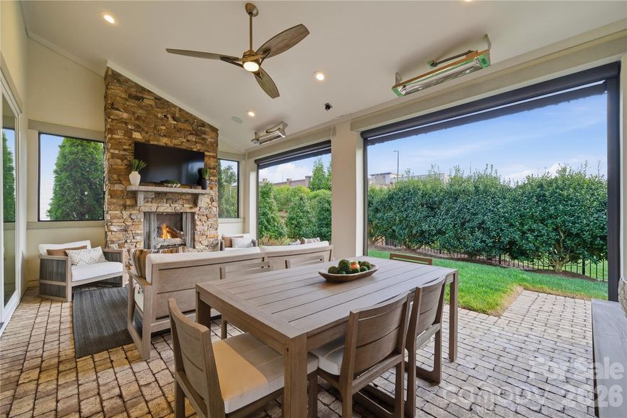 There is a certain kind of home that feels immediately, unmistakably right. This is that home.

Effortless luxury. Thoughtful design. A lifestyle worth coming home to. Welcome to 1016 Thatcher Way.

The heart of this 2022 Classica Home is a 16-foot accordion glass wall that opens to a resort-caliber outdoor living room - stone fireplace, retractable screens, ceiling heaters, lounge and dining for a crowd. Year-round. Rain or shine. Approx 300 sq ft to relax and enjoy. Perfect for morning coffee or an evening cool down with your favorite beverage.

Inside, 3,746 square feet of wide-plank white oak hardwoods, designer lighting, and plantation shutters create an environment of luxury. The kitchen centers on a striking 10-foot quartz island with upgraded cabinetry, gas range, and walk-in pantry - built for hosting the people you love with the sophistication they deserve. The main-floor primary suite offers a spa-level shower with dual shower heads, custom vanity, and integrated laundry, because convenience at this level is not optional. A first-floor guest suite means your guests feel as cared for as you do.

Upstairs: a bonus loft, media space, dedicated office, flex room, and two en-suite bedrooms - every space purposeful, every detail considered.

The yard is intentionally scaled for the buyer who values time over turf, easy to maintain, easy to leave, and perfectly complemented by the Pavillon Pocket Park just steps away whenever you want more green space.

Situated in Fort Mill's Arden Mill community — minutes from Kingsley, steps from the park, and a short commute to Charlotte with South Carolina's tax advantage. Fort Mill School District: ranked #1 in South Carolina. This is the home your next chapter has been waiting for, at an incredible price!

Full interactive 3D tour available. See media links.