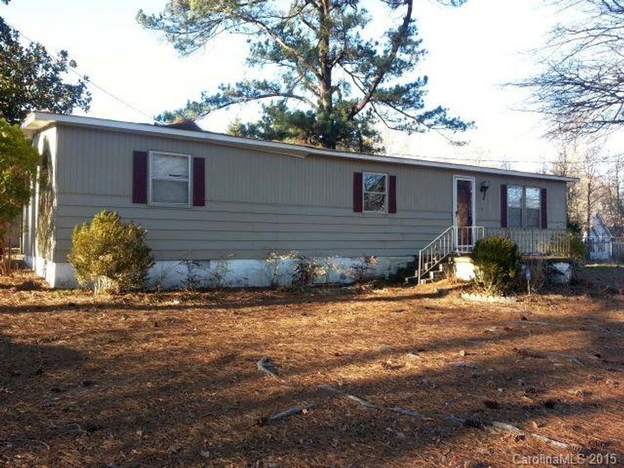 Nice double wide w/workshop &/or second living quarters on approx. 0.77 of an acre. Low county taxes, no restrictions. Close to everything. Second living quarters tenant occupied on month to month basis. 24 hour notice preferred. Appointment required. Sold AS-IS.