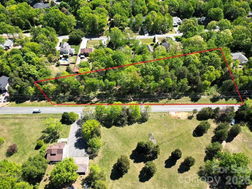 Exceptional Investment Opportunity!! Ready to Build!! Water & Sewer Accessibility!! Don’t miss this rare, shovel-ready development opportunity in a highly sought-after location! This 2.46-acre property, now annexed into the Town of Harrisburg, comes with approved subdivision plans for 4 residential lots—saving you time, money, and uncertainty. Start building immediately and capitalize on the area’s rapid growth. With an impressive 483 feet of road frontage and several beautiful mature trees, this property offers both flexibility and natural appeal—perfect for creating desirable new homes. All major utilities are available, including Charlotte Water (tap fees required), Duke Energy, Piedmont Natural Gas, Spectrum (TWC), Verizon, and AT&T—making development seamless and efficient. Prime Location, Unmatched Convenience: Walking distance to the Hwy 485 & Rocky River Rd interchange. Minutes from shopping, dining, and essentials including Harrisburg Town Center, Harris Teeter, medical facilities, and more. Less than 10 minutes to UNC Charlotte, CPCC Cato Campus, Reedy Creek Park, the Blue Line Extension, Uptown Charlotte, Charlotte Motor Speedway, and Concord Mills. This is a turnkey investment with approvals already in place in one of the Charlotte area’s fastest-growing corridors. Whether you’re a builder or investor, opportunities like this are extremely limited. Act quickly—this is the kind of deal that doesn’t come around often!