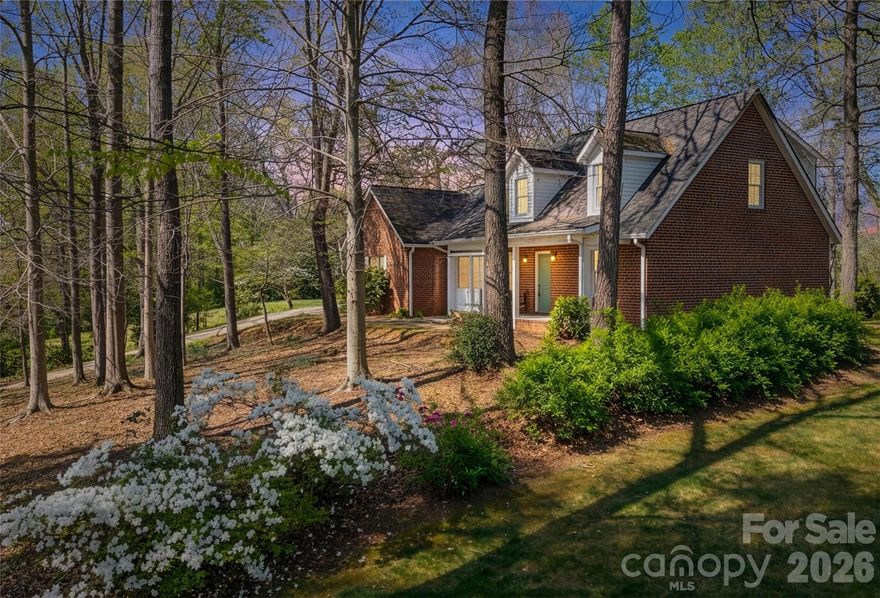 Classic, all-brick home perched on gentle hill in established Lenoir neighborhood.  Quality construction.  Mountain views from front and rear of the home add to the character and warmth of the property.  3 bedroom, 2 1/2 bath, two story with full basement.  Primary bedroom on main with full bath, Jacuzzi and separate shower and walk-in closet.  Newly refinished beautiful hardwood floors on main.  Bright and inviting eat-in kitchen with bay window, kitchen island, ample cabinet space.  Electric cooktop, wall oven, raised dishwasher.  Separate Laundry room and separate mudroom stubbed for full bath/shower off two-car garage. Enclosed patio off living room is a cozy den with a rock fireplace, rough hewn beams and tile floor.  Half bath on main.  Upper level includes two bedrooms, full bath, bonus room and a dedicated craft room with lots of cabinets and storage.  These rooms can function as game room, home office, studio or guest overflow.  Multiple attic storage spaces.  Gas water heater, heat pump.  Low maintenance exterior, low maintenance front yard with natural landscaping and tall trees for shade.