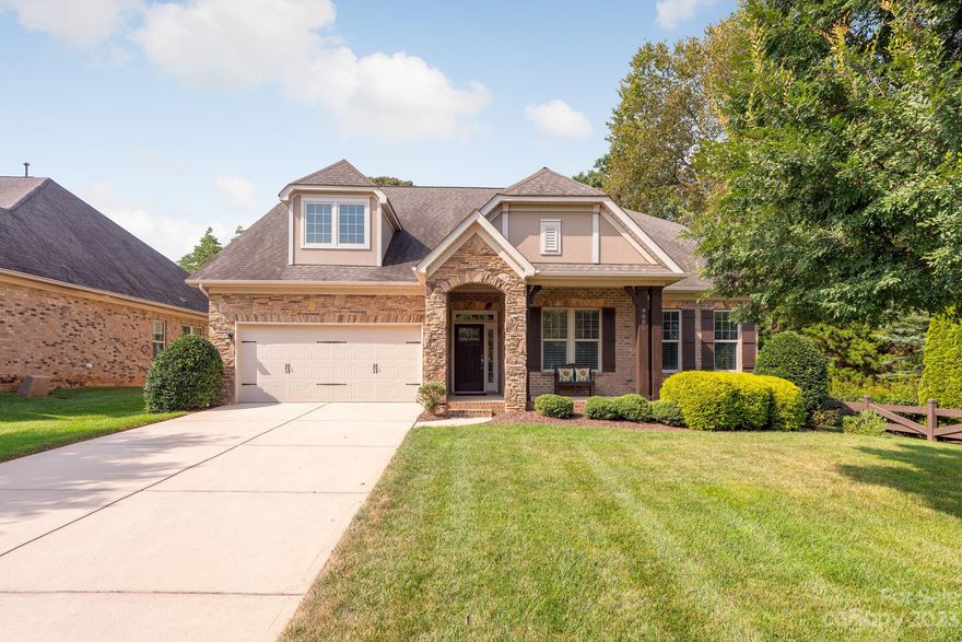 Impeccably maintained, low maintenance, one-story living in desirable Barber Rock. This 3 bedroom, 2 bath full brick and stone home with study has been gently lived in by seasonal owners. The spacious primary bedroom features a large bay window, walk-in closet and a luxurious en-suite with double vanity, soaking tub, and separate shower. Two secondary bedrooms are generously sized and share a full bathroom. The kitchen boasts granite countertops, stainless steel appliances, and a large island overlooking the great room with stone fireplace. A light-filled breakfast room is perfect for enjoying your morning coffee or step out onto the covered patio and take advantage of the manicured, irrigated lawn. The formal dining room is perfect for entertaining, and the extensive moldings, wainscoting, upgraded lighting and 10 foot ceilings throughout are sure to impress. Barber Rock residents enjoy serene surroundings convenient to Ballantyne as well as a neighborhood pool and playground.