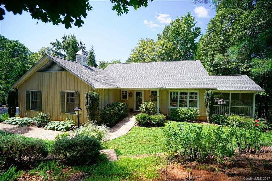 Beautiful home in desirable Tryon location! Only 5 minutes to town & a short walk to Harmon Field Park. Quality features, spacious rooms & hardwood floors. Main Level: Lg. living rm w/FP, MBR suite w/luxury his & hers baths & walk-in closets, lovely bright kitchen open to breakfast rm, dining rm w/french doors to deck. Over-sized 2-car garage. Finished lower level offers lg family rm, 2BR's, ba & office. Professional stonework & landscaping. Screen porch & deck make it perfect for entertaining.