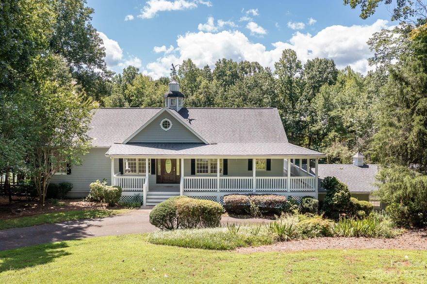 This property truly has it all! Located in a tranquil cove on LKN, home boasts a stunning WF view, pier, dock, & covered lift, perfect for all of your boating needs. Almost 1 acre lot w/plenty of space for outdoor activities, including an inground pool & fenced rear yard. Home offers a split brm plan, providing ample space & privacy for the lakeside primary brm. Kit opens up to bkfst area, perfect for enjoying your morning coffee while taking in the serene scenery. If you love to entertain, the rec rm & wrap-around front & side porch are perfect for hosting gatherings w/family & friends. Property also includes 1,121 sq ft covered carport w/plenty of space for boat & PWC storage, extra cars, entertaining space, or expansion. What's even better is that there's no HOA to worry about! And if you're looking for more privacy, the sellers also own the 1.78 acre lot next door, which is available for sale separately. Don't miss this opportunity to own a little slice of paradise on the lake!
