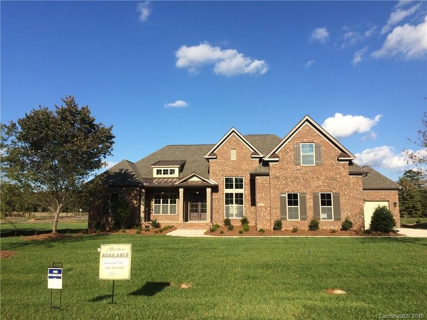 Popular ranch plan - the Sullivan is open & bright w/ lots of space! Full brick w/ a 4-car garage. Family room has vaulted ceilings open to beautiful kitchen w/ a 12' long granite island, upgraded cabinets and Electrolux stainless steel appliances. Butler's pantry w/ wine cooler. Covered deck overlooks large backyard. Study w/ French doors & a grand dining room w/ 14' ceilings. Master bedroom features box beam ceiling treatment, large master bath & huge WIC. Extended bonus room over the garage.