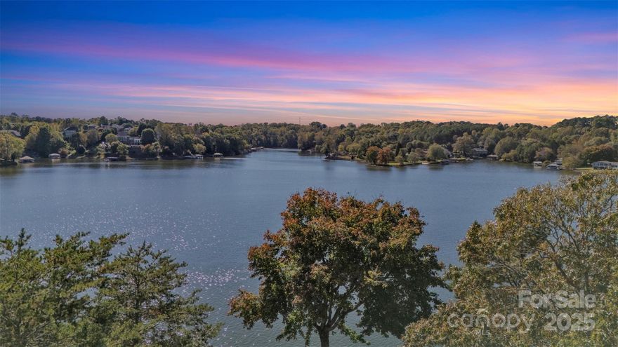 Discover the crown jewel of Lake Hickory — an extraordinary 1.8+ acre homesite with approximately 444 feet of pristine water frontage and the most breathtaking sunset views on the lake. Gently sloping terrain leads to a perfectly carved path to the shoreline, making every day lake access effortless and enjoyable. This lot has been cleared and prepped for a perfect homesite - bring your builder- it is ready! Positioned on one of the lake’s most desirable deep-water points, this property offers year-round navigability, privacy, and panoramic views — the ideal setting for a custom dock and luxury waterfront retreat. Located just an hour from Charlotte and the Blue Ridge Mountains, this property blends tranquil lakefront living with easy access to airports, fine dining, and golf. With utilities nearby and an ideal building envelope, this is a rare opportunity to create an architectural masterpiece that embraces the best of North Carolina’s lake lifestyle.