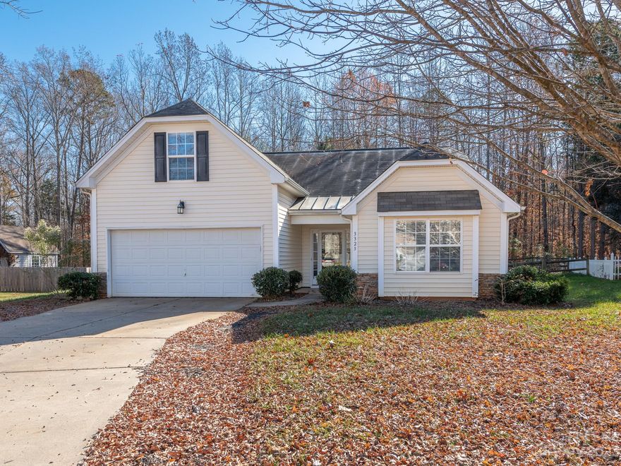 Spacious & well maintained home w/ upstairs bonus room & fantastic amenities! Located in the Indian Land school district, this home welcomes you into open living, dining & kitchen area. Large windows flood home w/ natural light + NEW vinyl plank flooring throughout entire main level. Living room has a vaulted ceiling & cozy gas fireplace. Dining area off to the side has sliding door leading to covered back patio. Kitchen w/ open bar area is perfect for hosting & has S.S appliances + tons of cabinets, counter space & pantry for plenty of storage. Primary bedroom again w/ vaulted ceiling has spacious en-suite w/ dual sinks, soaking tub, stand-up shower & large walk-in closet w/ storage drawers. 2 additional bedrooms w/ full hall bath ideal for friends & family. Upstairs bonus room is carpeted and perfect for home office or recreation area. Private backyard is fully fenced and patio extends for grilling. Community pool, game courts & pond perfect for year round fun. A MUST SEE!