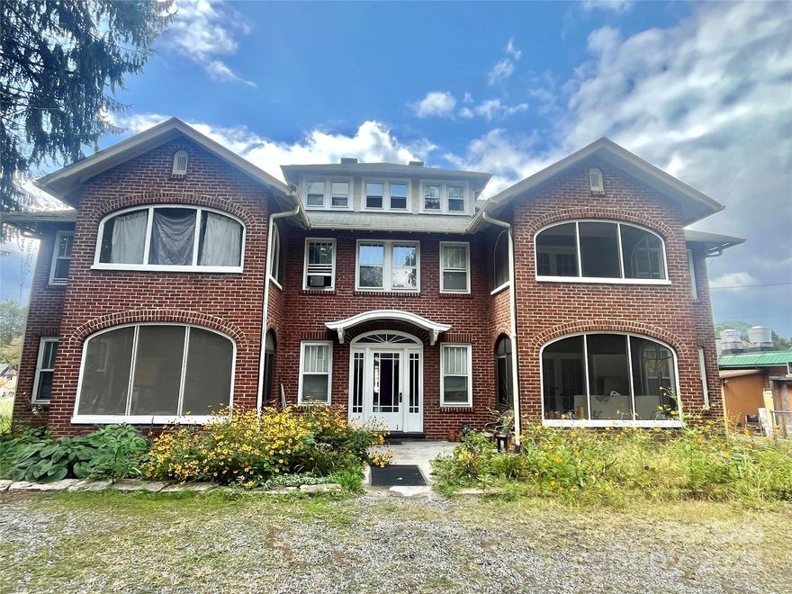 OWNER FINANCING: Clasic 1950s Brick Traditional Building walk to downtown Waynesville shops and restaurants . On site parking and mix use commercial zoning. Ten 1 bedroom units and One  2 bedroom apartment over garage. Ready for some TLC. Building does not have central AC so that upgrade would be essential for top rents. Zoning allows short term rentals and mixed use commercial.  Seller would consider 50% Owner financing. Access off side street 38 Hazel.