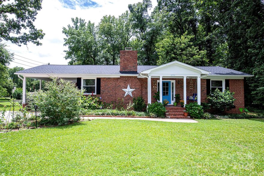 Don't miss your chance to experience this charming retreat on 1.76 acres -an exceptional opportunity to create your own private sanctuary. Located in the sought after Quiet Acres neighborhood, this all-brick home will impress you. Step inside to discover a warm & inviting with original hardwoods in throughout including the family room with beautiful wood burning fireplace, tons of light & open to the dining area. 2 large bedrooms with double closets share the large bathroom with a tub/shower combo & 2 vanity spaces. Kitchen features tons of storage, a walk-in pantry & stainless-steel appliance. Laundry room is located off the kitchen, an additional storage room on the carport & a new shed for outside storage needs. Outside, the expansive yard provides endless opportunities for relaxation & recreation. Enjoy morning coffee on the sunny deck or the front porch swing. Brand new roof, newer HVAC system & water heater make this home a must see!