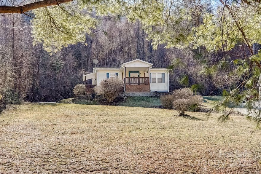 Nestled in the serene beauty of Maggie Valley, North Carolina, this charming single-level home with 2 bedrooms and 2 baths is a delightful find just off Soco Road. The convenient side door entrance leads you straight into the well-appointed kitchen, which features brand new appliances and a washer/dryer combo that is practically new. Stepping into the cozy living room, you'll appreciate the modern furniture that comes with the property, as well as the furnishings in both bedrooms. The recent installation of new flooring in the bathroom offers a fresh touch, allowing you the flexibility to further update the space to your liking. Whether you're seeking a permanent mountain retreat or considering a venture into short-term rentals, this home provides the ideal space for both dreams. Asheville is 35 minutes away and Waynesville only 11 minutes. 
Don't miss the chance to explore this gem today - opportunities like this tend to vanish quickly!