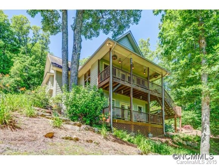 Dream home in romantic and secluded setting with a "close to town" feel! Enjoy mountain views from covered porches on 3.63 private acres with creek at lower edge of property. Great Room with dining area, kitchen, master and 2nd bedroom, 1.5 baths on main level. 300 sqft loft -optional 3rd bedroom or office. Lower level (500 sqft) perfect for guest/in-law suite w/ kitchen & full bath. Home includes cherry hardwood floors.