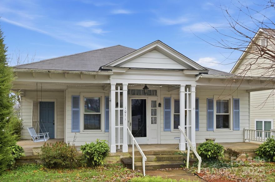 Charming historic home featuring tall ceilings, double French doors, wood floors, a welcoming front porch, and a fireplace. Zoned B-3 for flexible use—business/office, single-family, or multifamily residential. Includes 3 bedrooms, 2 bathrooms, and a full basement. Home requires significant repairs, but plumbing and HVAC are functional. Recent inspection available and ready for the right buyer’s vision. Some photos are enhanced to show how the floors could look after refinishing.