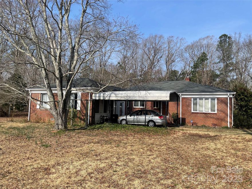Nice one-story brick home on a large lot in the county. Home features living room, dining area, breakfast area, and a large primary bedroom. Home could use some updating. Home sits on a 1.42 acre lot and has a fenced back yard. Loads of potential!!