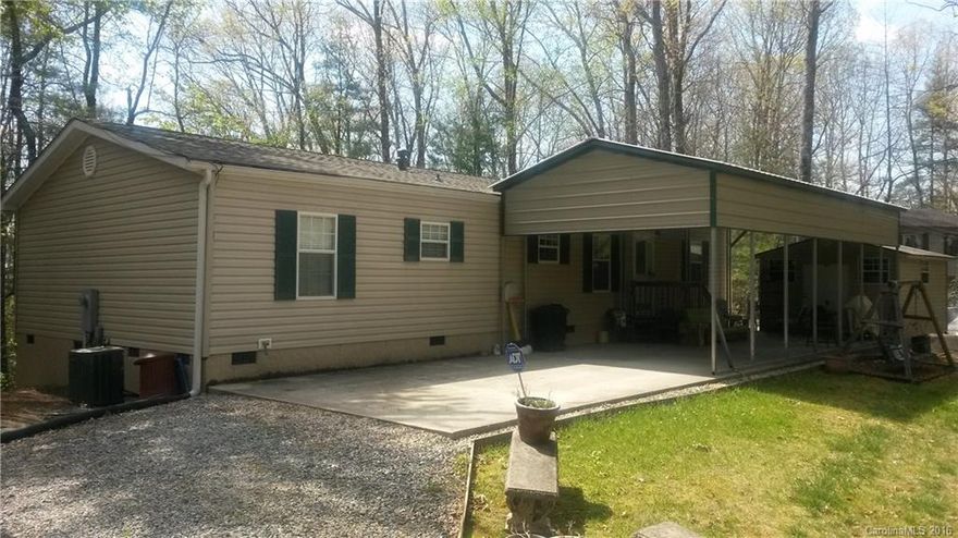 Open, Spacious 3 Bedroom nestled in Pisgah Forest, only 5 minutes from downtown. Remodeled with bamboo wood floors in family room and dining room. Laminate wood floors in kitchen and bathrooms. Carpet in bedrooms and living room. Enclosed screened in porch with winter mountain views. White squirrels and deer are regular visitors. Large workshop off of carport. Carpets freshly shampooed and home has been professionally cleaned. Owners are motivated to sell.