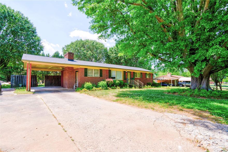 3 bedroom 1 bath brick ranch home with wood trim in established neighborhood outside of the city limits. No HOA and no city taxes! Convenient location near to town, shopping, restaurants, medical, etc. Home features both a living room and a den with gas log fireplace. Den has built-in shelves and cabinets. Dining Room has French doors leading to rear patio. Kitchen has a breakfast bar and lots of cabinets. Bathroom has new vanity and toilet. LVP flooring and neutral colors throughout. Home has a single carport, concrete drive and extra parking pad, providing plenty of parking. Spacious back yard with 2 patios and a storage building with lean-to shed. Being sold cash or conventional only.