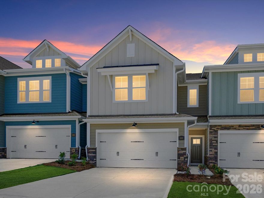 Experience the perfect blend of modern style and small-town warmth in the Mecklenburg plan at Westview Towns. Nestled near the shops, restaurants, and historic charm of Downtown Waxhaw, this beautifully designed townhome offers a lock-and-leave lifestyle, giving you more freedom to enjoy what you love most. Step inside to discover light-filled, open spaces that combine function and sophistication. The gourmet kitchen is the centerpiece of the home, featuring elevated, curated countertops, striking shiplap accents, an oversized island, and abundant cabinetry—creating a space as stylish as it is practical. The LVP stair treads, coordinated with the main-level flooring, bring continuity and warmth throughout the home. Oversized windows fill each room with natural light, while a covered rear porch extends your living space outdoors—perfect for a quiet morning coffee or evening unwind. And with included lawn maintenance, you’ll enjoy true lock-and-leave convenience in a low-maintenance community.