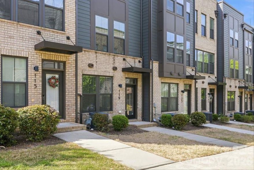 Experience elevated urban living in this like-new, four-story townhome ideally situated in the heart of South End—just steps from premier dining, shopping, breweries, grocery stores, and the light rail. Thoughtfully designed with both everyday comfort and entertaining in mind, this home showcases a spacious rooftop terrace, tandem two-car garage, and a chef-inspired kitchen featuring an oversized island, quartz countertops, and stainless steel appliances.

The main level features a light-filled, open-concept floor plan that seamlessly connects the living, dining, and kitchen areas - perfect for gathering before a night out or enjoying a quiet evening in. Upstairs, the third floor offers a desirable split-bedroom layout, highlighted by a generous primary suite complete with a walk-in closet, dual vanities, and an oversized walk-in shower. A secondary bedroom and full bath complete this level.

The top floor provides exceptional flexibility with a third bedroom, full bath, and versatile loft space that opens directly to the expansive rooftop terrace - creating the ultimate setting for entertaining or unwinding with skyline views.